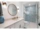 Elegant bathroom with stylish vanity, modern fixtures, and a glass-enclosed shower with beautiful tile work at 1891 Lake Spier Dr, Winter Park, FL 32789