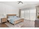 Serene bedroom with natural light and light wood floors at 1891 Lake Spier Dr, Winter Park, FL 32789