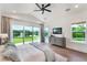 Inviting main bedroom with sliding glass doors to lake view, offering a serene retreat at 1891 Lake Spier Dr, Winter Park, FL 32789