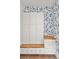 Well-organized mudroom with custom storage cabinets, drawers, and a comfortable bench seat at 1891 Lake Spier Dr, Winter Park, FL 32789