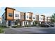 Modern townhouse complex showcasing clean lines, mixed materials, and ample parking at 209 Breezeway Dr, Davenport, FL 33897
