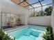 Inviting pool area with comfortable lounge seating and view to living area at 209 Breezeway Dr, Davenport, FL 33897