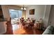Bright dining room next to sliding glass doors and a view of the back yard at 2157 Island Walk Dr, Orlando, FL 32824