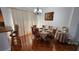 Cozy dining room features a table with seating for six and natural light at 2157 Island Walk Dr, Orlando, FL 32824