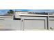 Modern townhome exterior featuring a grey garage door and coordinated paint at 2157 Island Walk Dr, Orlando, FL 32824