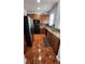 Efficient kitchen with ample counter space, stainless refrigerator and black appliances at 2157 Island Walk Dr, Orlando, FL 32824