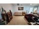 Cozy loft space with bookshelves, a sofa, and neutral decor at 2157 Island Walk Dr, Orlando, FL 32824