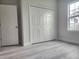 Bright bedroom features a large closet and natural light from the window at 2333 Sw 147Th Pl Rd, Ocala, FL 34473