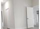 Clean hallway with closet and view of the living room at 2333 Sw 147Th Pl Rd, Ocala, FL 34473