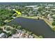 Aerial view of a community set around a beautiful lake, showcasing the desirable location at 2501 Grassy Point Dr # 103, Lake Mary, FL 32746