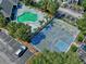 Features an aerial view of a community's pool, basketball court and parking at 2501 Grassy Point Dr # 103, Lake Mary, FL 32746