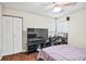 Bedroom showing a closet and game chair area, and a large flatscreen television at 2501 Grassy Point Dr # 103, Lake Mary, FL 32746