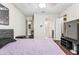 Bedroom with hardwood floors, ceiling fan, and doorways to bathroom, kitchen, and closet at 2501 Grassy Point Dr # 103, Lake Mary, FL 32746