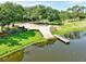 Scenic lake view features a boat ramp and a quaint pier, inviting water adventures at 2501 Grassy Point Dr # 103, Lake Mary, FL 32746
