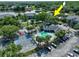 A full overhead shot of the community pool, hot tub, basketball court, and parking area at 2501 Grassy Point Dr # 103, Lake Mary, FL 32746