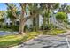 Landscaped condo complex with mature trees, featuring convenient parking and accessible access at 2501 Grassy Point Dr # 103, Lake Mary, FL 32746