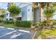 Condo building with exterior stairs, well-maintained landscape and convenient parking at 2501 Grassy Point Dr # 103, Lake Mary, FL 32746