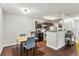 Kitchen and dining area featuring rich wood cabinets and granite countertops at 2501 Grassy Point Dr # 103, Lake Mary, FL 32746