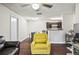 Bright living area provides an open layout with views of the dining area and kitchen at 2501 Grassy Point Dr # 103, Lake Mary, FL 32746