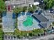 Overhead view showcases the pool, hot tub, and basketball court, complemented by palm trees and parking at 2501 Grassy Point Dr # 103, Lake Mary, FL 32746