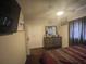 Bedroom with ceiling fan, dresser and large closet at 2506 Perrine Pl, Orlando, FL 32808