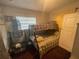 Bedroom with bunk bed and window with yellow curtain at 2506 Perrine Pl, Orlando, FL 32808