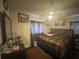 Bedroom features ceiling fan, window, and matching furniture at 2506 Perrine Pl, Orlando, FL 32808