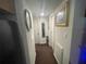 Hallway features neutral walls, carpet and a picture in a gold frame at 2506 Perrine Pl, Orlando, FL 32808