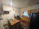 Functional kitchen featuring a dining area with ample counter and cabinet space at 2506 Perrine Pl, Orlando, FL 32808