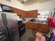 Kitchen featuring wooden cabinets and stainless steel refrigerator at 2506 Perrine Pl, Orlando, FL 32808