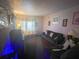 Spacious living room with contemporary decor, comfortable seating, and ample natural light at 2506 Perrine Pl, Orlando, FL 32808