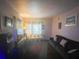 Inviting living room featuring modern furnishings, a sofa, and window lighting at 2506 Perrine Pl, Orlando, FL 32808