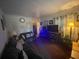 Comfortable living room with plush sofa and entertainment center; cozy interior at 2506 Perrine Pl, Orlando, FL 32808