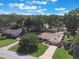 Aerial view of a beautiful home surrounded by lush greenery and mature trees at 3300 Se 22Nd Ave, Ocala, FL 34471