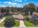 Aerial view of a well-manicured home and lush green lawn at 3300 Se 22Nd Ave, Ocala, FL 34471