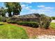 Well-maintained backyard with manicured landscaping and charming outdoor space at 3300 Se 22Nd Ave, Ocala, FL 34471