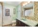 This bathroom features colorful tile, a modern sink and faucet, and a windowed door to the outside at 3300 Se 22Nd Ave, Ocala, FL 34471