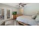 Relaxing bedroom with access to a private patio and an updated ceiling fan at 3300 Se 22Nd Ave, Ocala, FL 34471