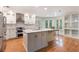 Bright kitchen featuring stainless appliances, large island, and a modern aesthetic at 3300 Se 22Nd Ave, Ocala, FL 34471