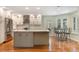 Bright kitchen featuring modern appliances, a central island, updated cabinetry, and a breakfast nook at 3300 Se 22Nd Ave, Ocala, FL 34471
