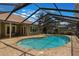 Screened-in pool with brick paved deck, sunroom, and backyard seating at 3300 Se 22Nd Ave, Ocala, FL 34471