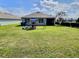 Large backyard with a swing set and play area, perfect for outdoor activities and Gathering fun at 3329 Royal Tern Dr, Winter Haven, FL 33881