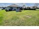 Large backyard with a swing set and play area, perfect for outdoor activities and Gathering fun at 3329 Royal Tern Dr, Winter Haven, FL 33881
