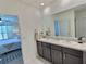 Bathroom featuring double sinks, ample counter space, and contemporary fixtures at 3329 Royal Tern Dr, Winter Haven, FL 33881
