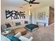 Cozy living room with a comfortable sectional sofa, stylish decor, and ample natural light at 3329 Royal Tern Dr, Winter Haven, FL 33881