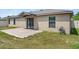 The backyard has a brick patio and sliding glass doors leading inside to the home at 337 Southern Winds Blvd, Deland, FL 32720