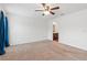 Large bedroom features neutral carpet and an open doorway to an en-suite bathroom at 337 Southern Winds Blvd, Deland, FL 32720