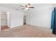 Large bedroom features neutral carpet with doorways to a bathroom and closet at 337 Southern Winds Blvd, Deland, FL 32720