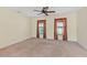 Spacious bedroom with neutral carpet, ceiling fan and natural light from two windows at 337 Southern Winds Blvd, Deland, FL 32720