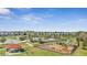 Wide aerial showcases community amenities with playground, pool, picnic shelter, and a view of neighborhood homes at 338 Wooded Vine Dr, Winter Springs, FL 32708